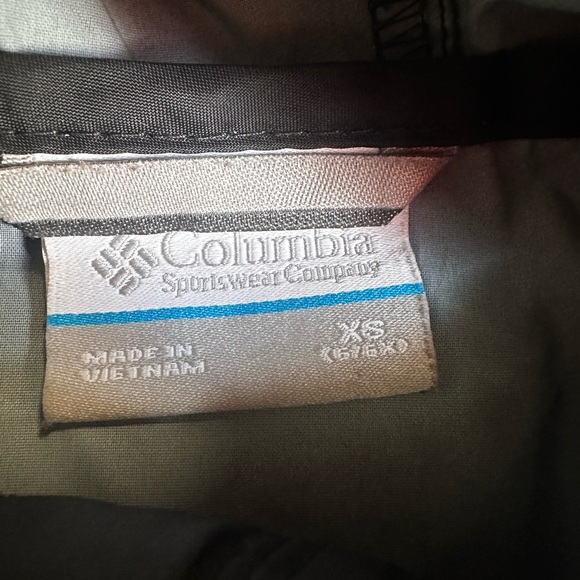 A Columbia rain jacket/wind breaker. It is black w/ a hood. No stains or tears. - Picture 2 of 4